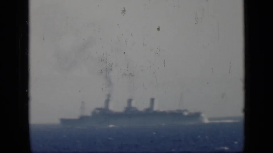 Distant steamship continues across the horizon in 1946 Egypt-associated home-movie footage, framed by dark film borders.