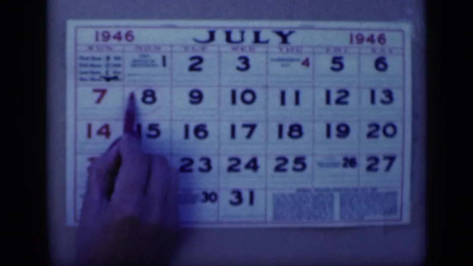 The final frame shows the pen at the July 8 position on the July 1946 calendar, with visible 8mm grain and tint.