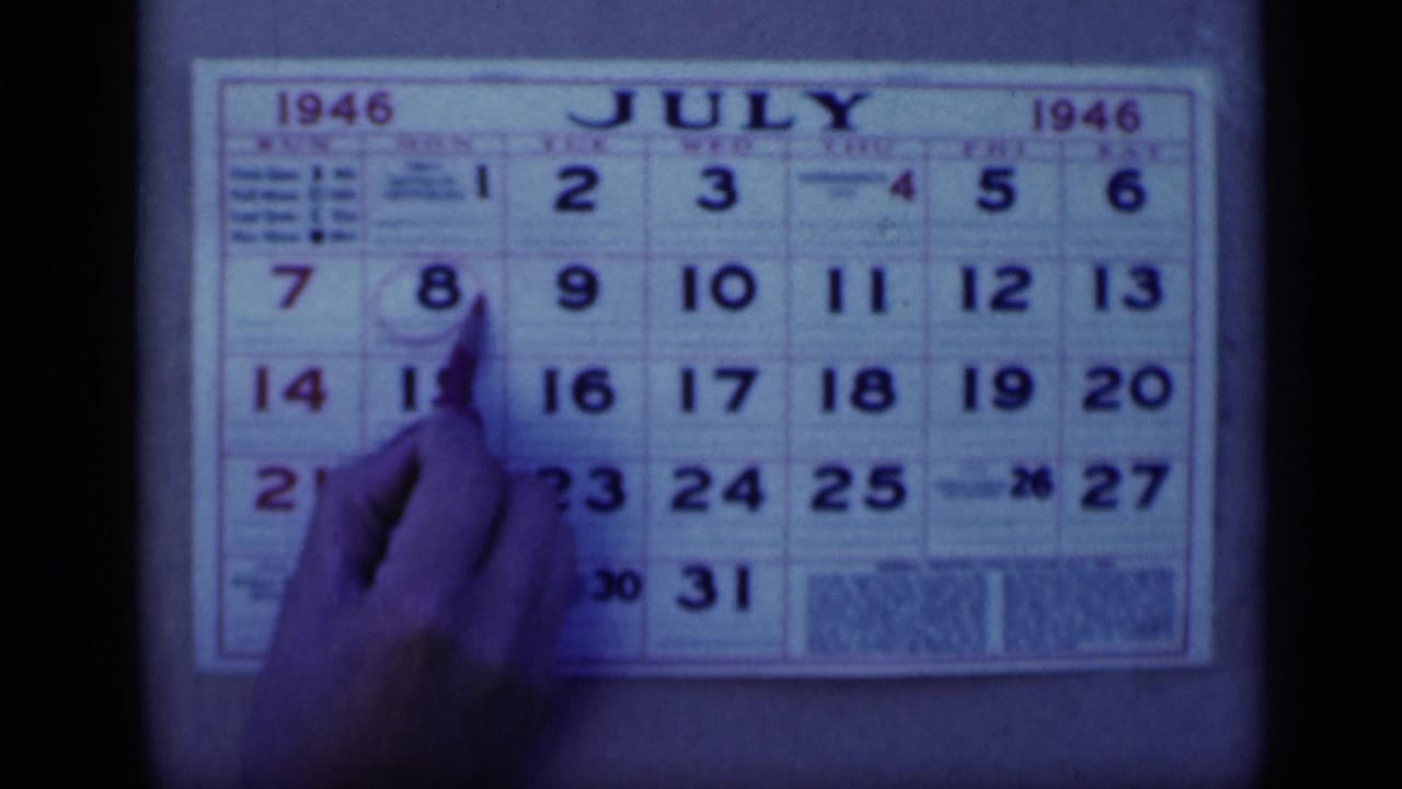 Hand and pen continue circling the date on a July 1946 calendar.