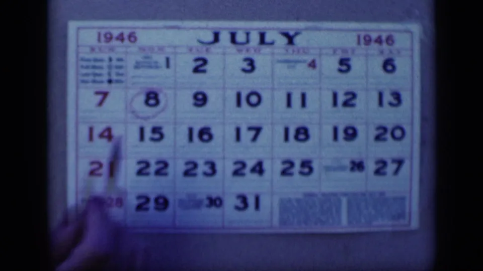 A July 1946 calendar fills the frame, with dates circled and a hand partially visible at the lower left.