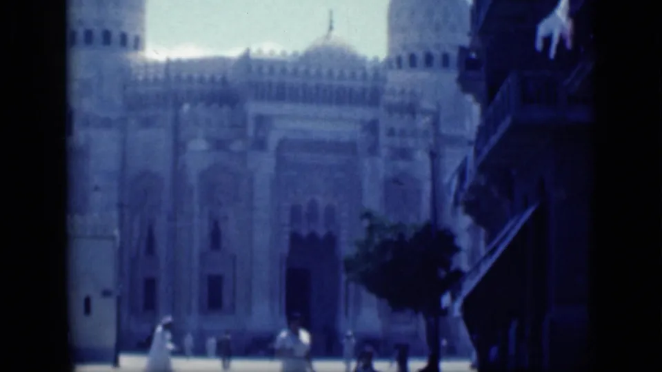 A wide 1946 Cairo view shows a large mosque facade with arched details, with small figures near the entrance area.