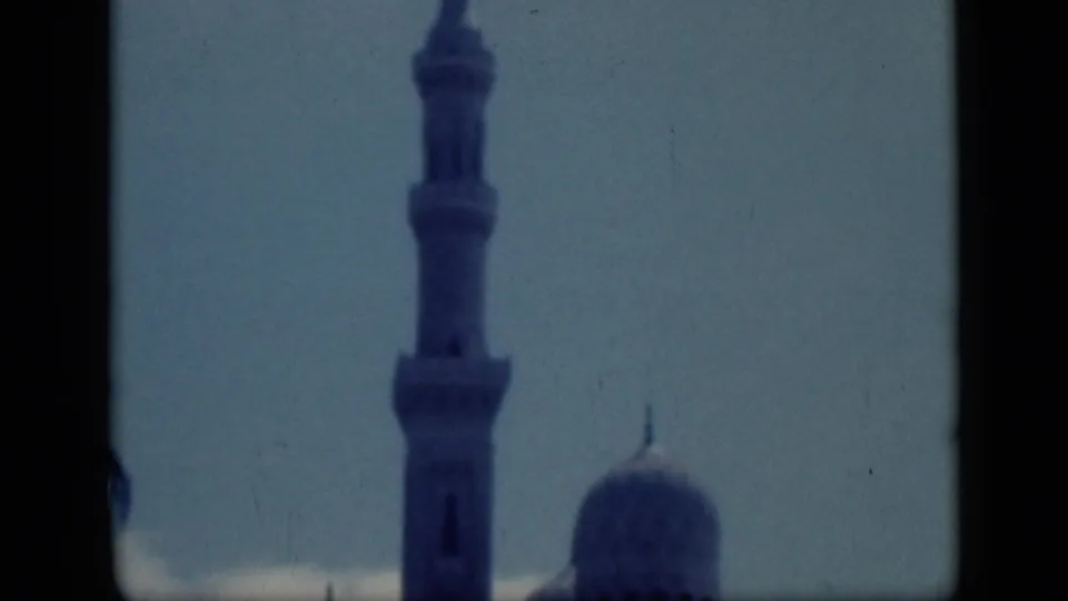1946 Cairo 8mm still with the minaret enlarged in frame and the dome partially visible at lower right.