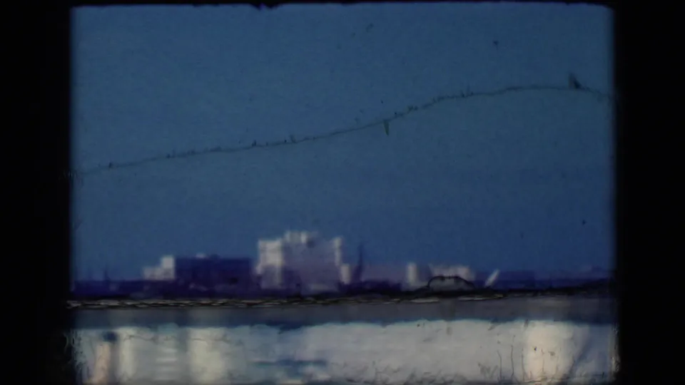 1946 Cairo 8mm frame with the white landmark low in the view, water below, and visible film scratches and gate edges.