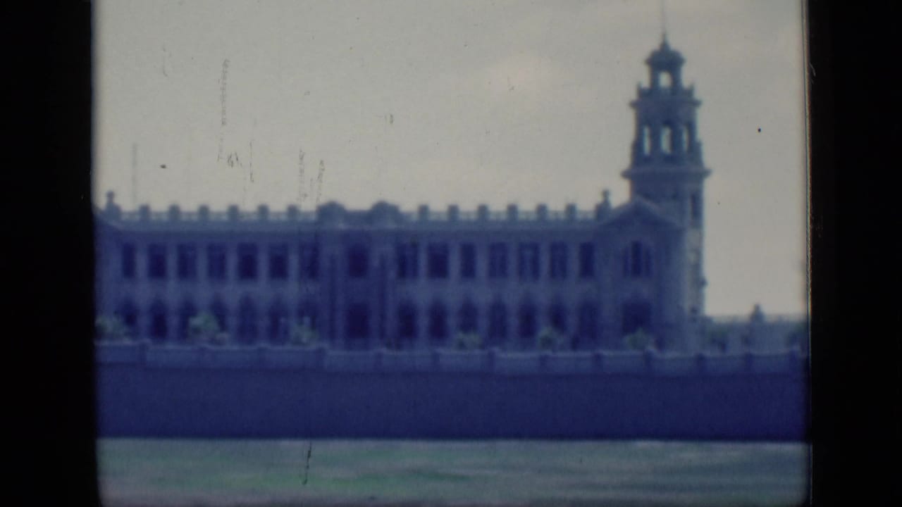 1946 Cairo footage showing a large ornate riverside building with a tower and arched window details.