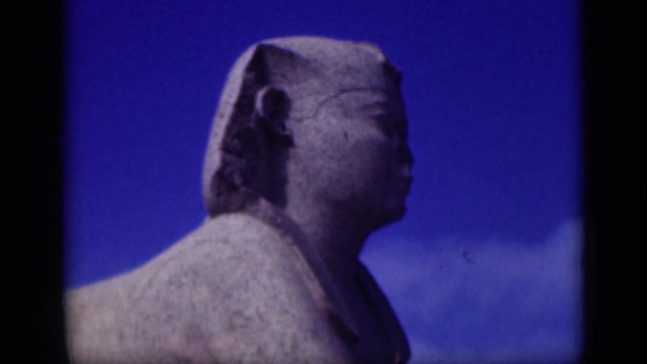 Cairo 8mm frame showing the Sphinx in side profile, tightly framed with film borders and weathered stone detail.