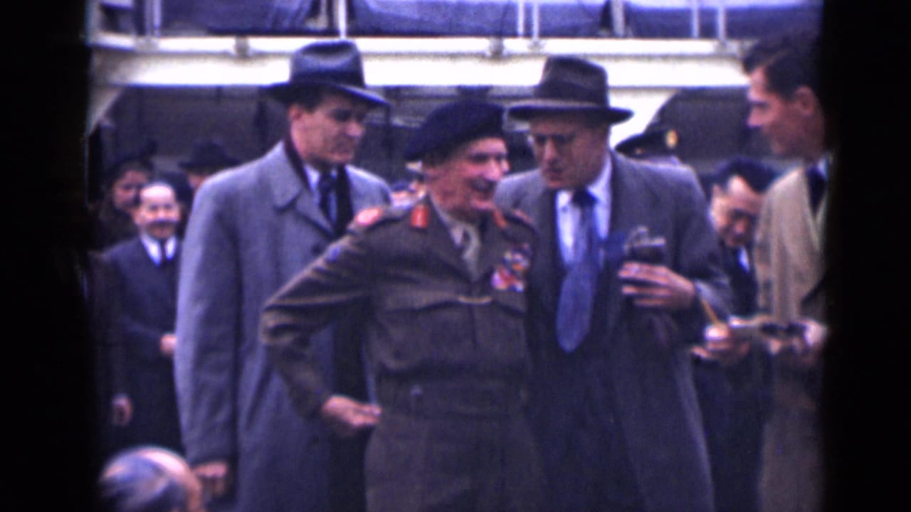 In 1946 London footage, a decorated army officer in beret and uniform walks with suited men and onlookers outside a formal building.