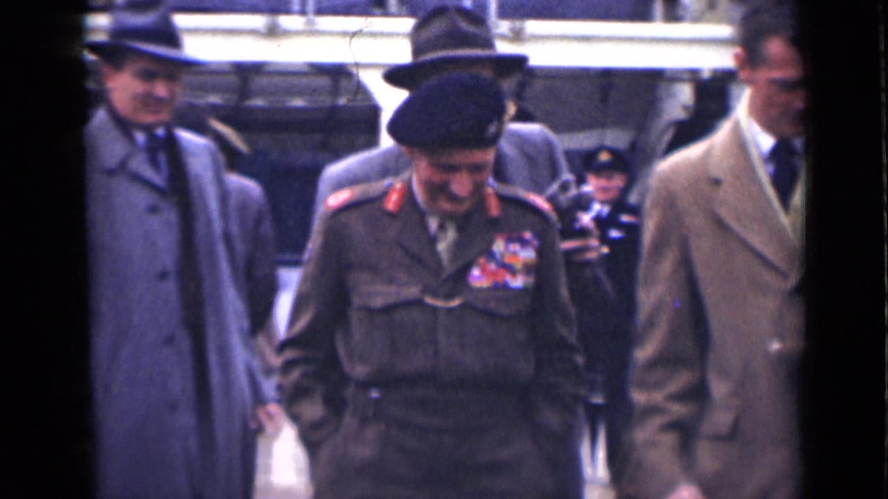 A decorated army officer in uniform and beret walks beside suited men in a crowded London street scene from 1946.