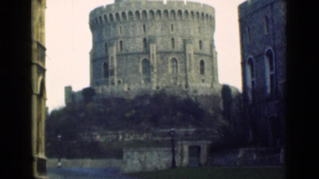 The Round Tower of Windsor Castle appears beyond a dark doorway or window edge in soft 8mm color footage from the 1940s.