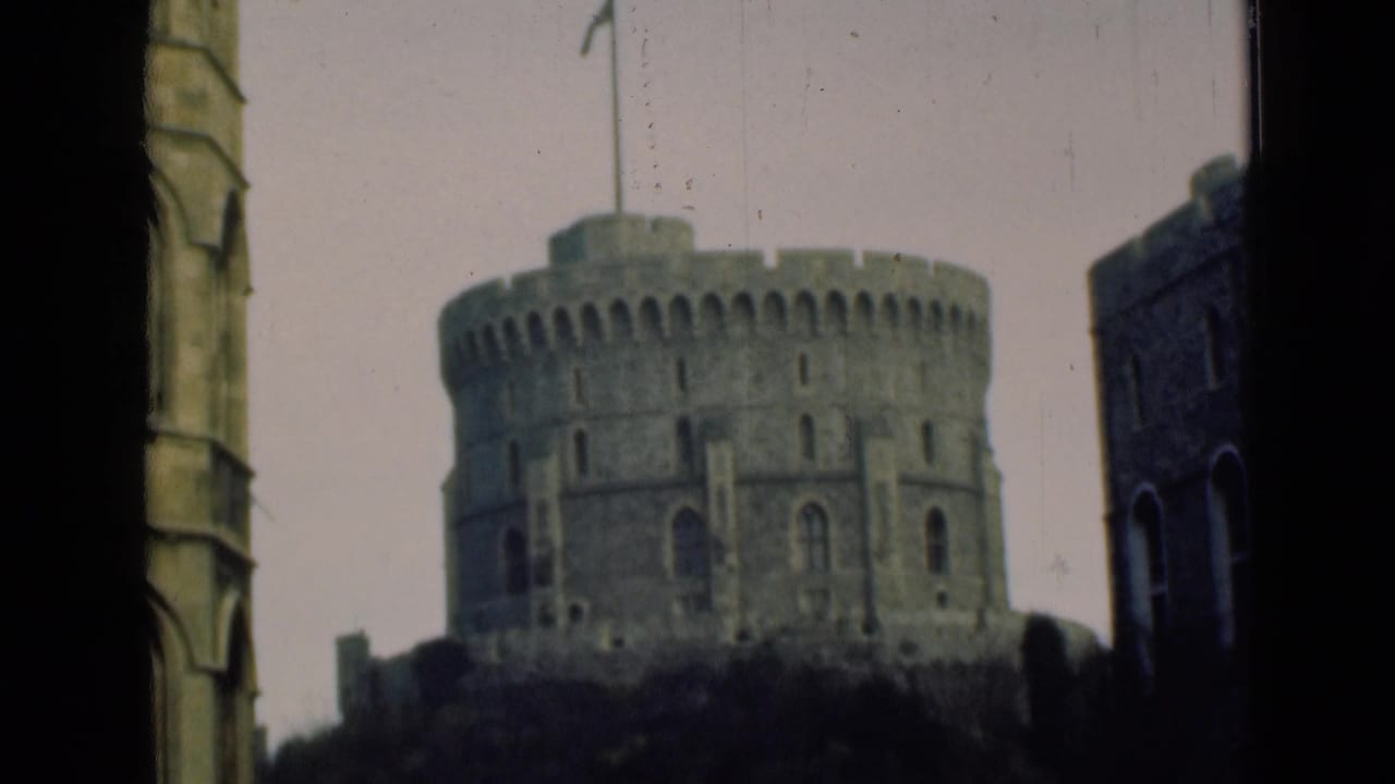 1946 8mm view of a round Windsor Castle turret framed by dark foreground architecture and pale sky.