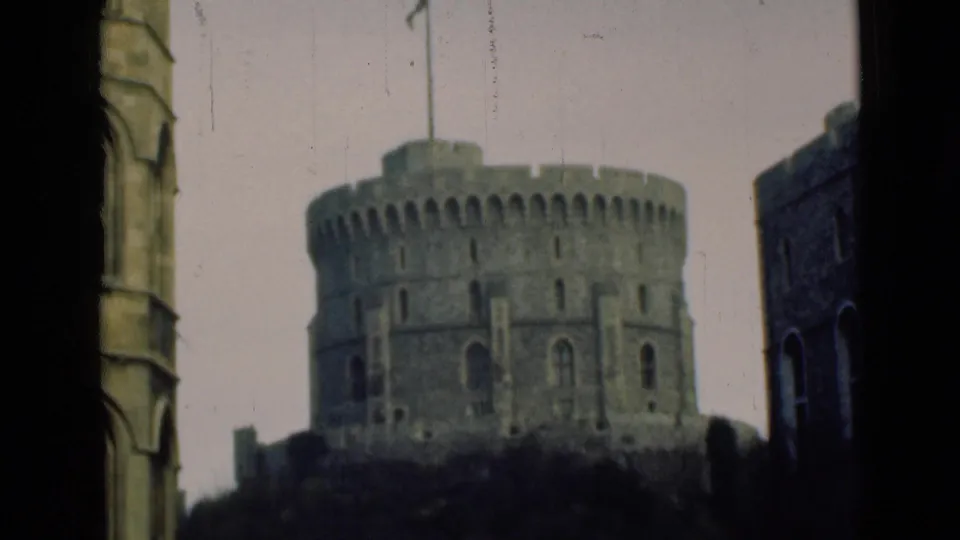A similar 1946 home-movie angle holds on the Windsor Castle turret with dark vertical framing at the sides.