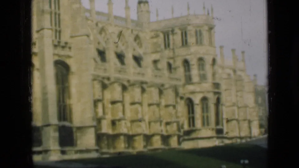 1946 London-area frame of ornate Gothic masonry, arched windows, and a paved edge beside the building.