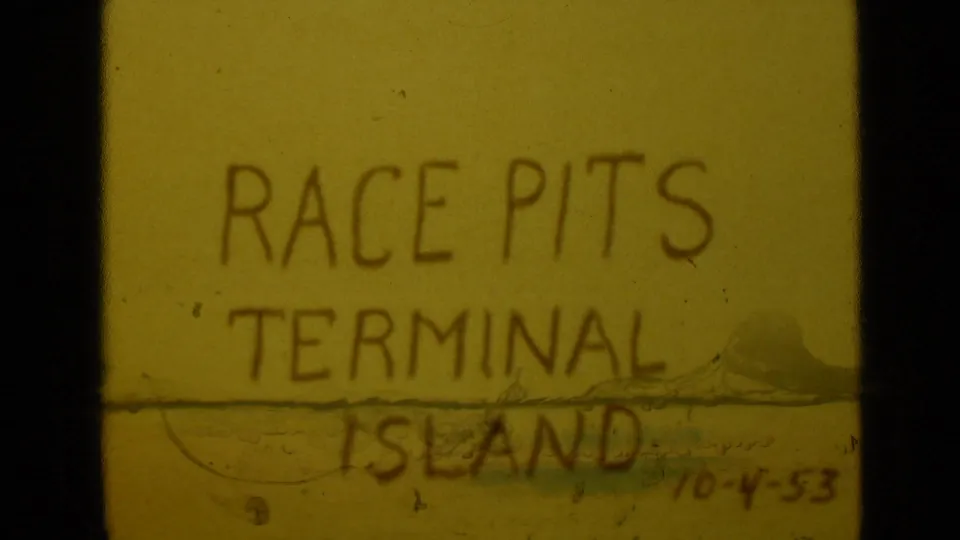 8mm title-card frame with Race Pits Terminal Island text partly softened by exposure variation, film scratches, and visible handwritten date.