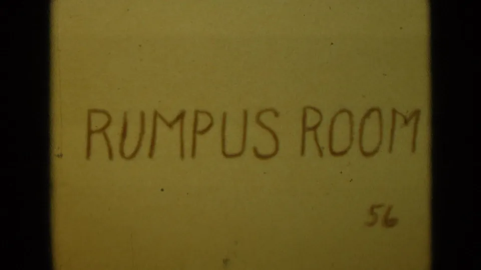 1949 home-movie title card with hand-drawn RUMPUS ROOM lettering and the number 56 on aged color stock.