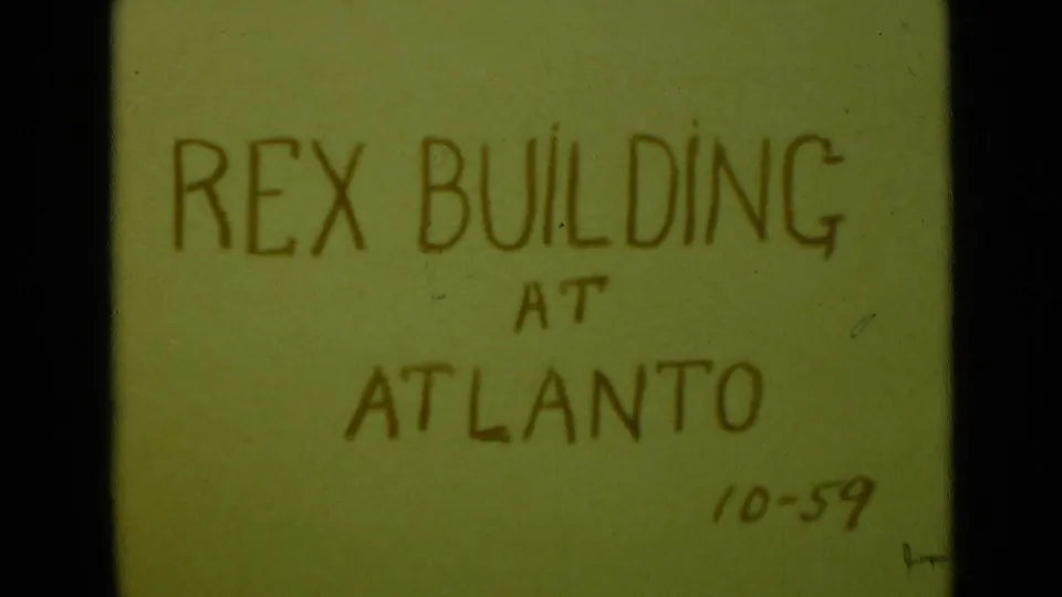 Another 8mm title-card frame shows the same handwritten Rex Building at Atlanto wording with a 10-59 date mark.