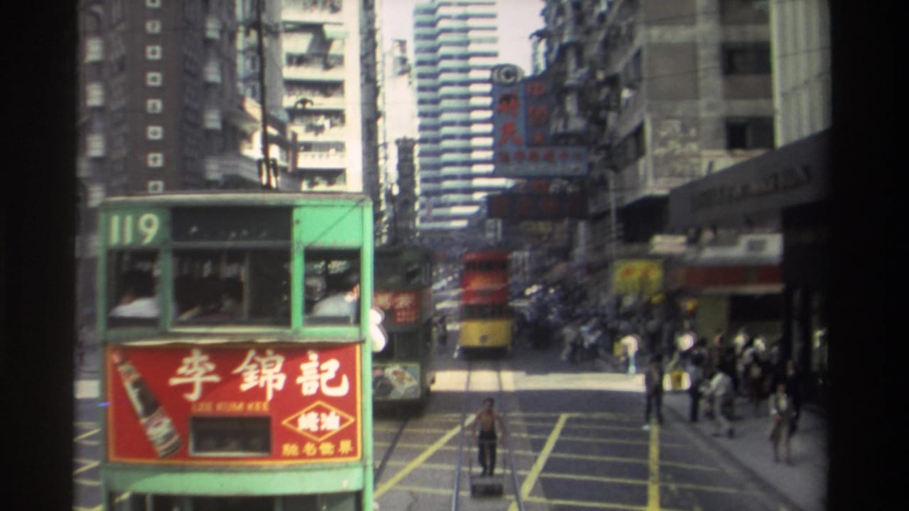 1982 Hong Kong tram view showing route 119, a red Lee Kum Kee ad, pedestrians, and dense Chinese signage along a city street.