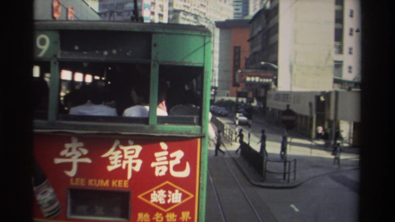 Route 9 green Hong Kong tram displaying a red Lee Kum Kee (李錦記) oyster sauce advertisement, with pedestrians and city buildings visible, 1982.