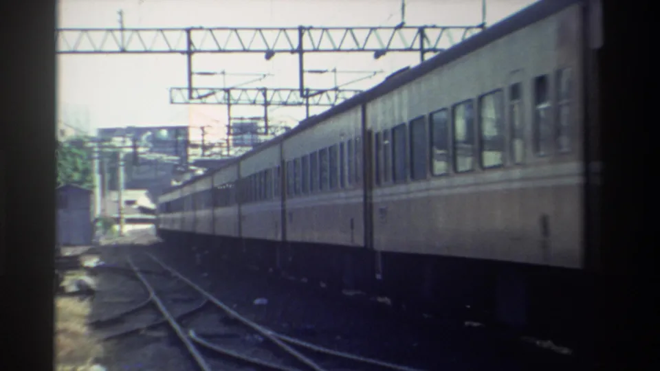 Final 1982 Taiwan frame shows the passenger train continuing past a fixed 8mm camera in a rail yard or station approach.