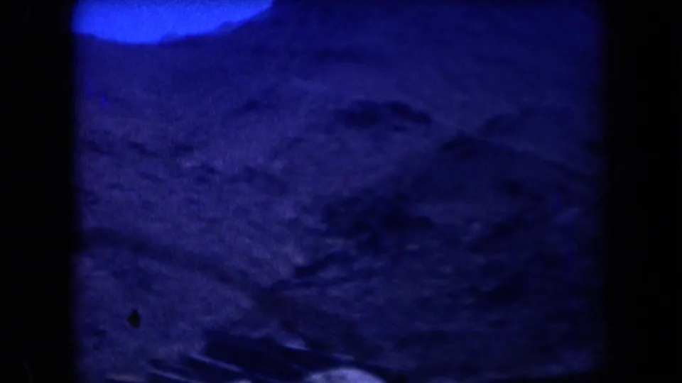 The final frame shows blue-cast rocky terrain, likely from the same Arizona home-movie scene, with people no longer clearly in view.