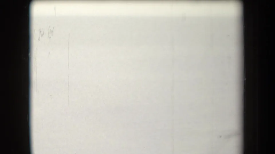 Overexposed 8mm frame with pale film surface, faint scratches, and darkened edges at the end of the short Arizona 1958 clip.