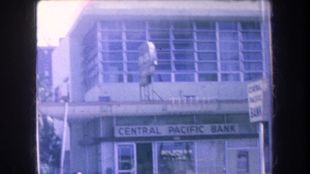 1969 Hawaii street view centered on a Central Pacific Bank facade, with signage, windows, and nearby street fixtures visible.