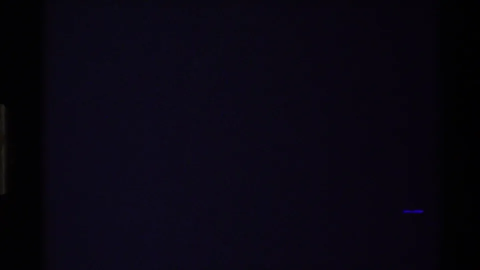 End frame appears mostly dark, with little visible landscape detail and a small blue streak near the lower right.