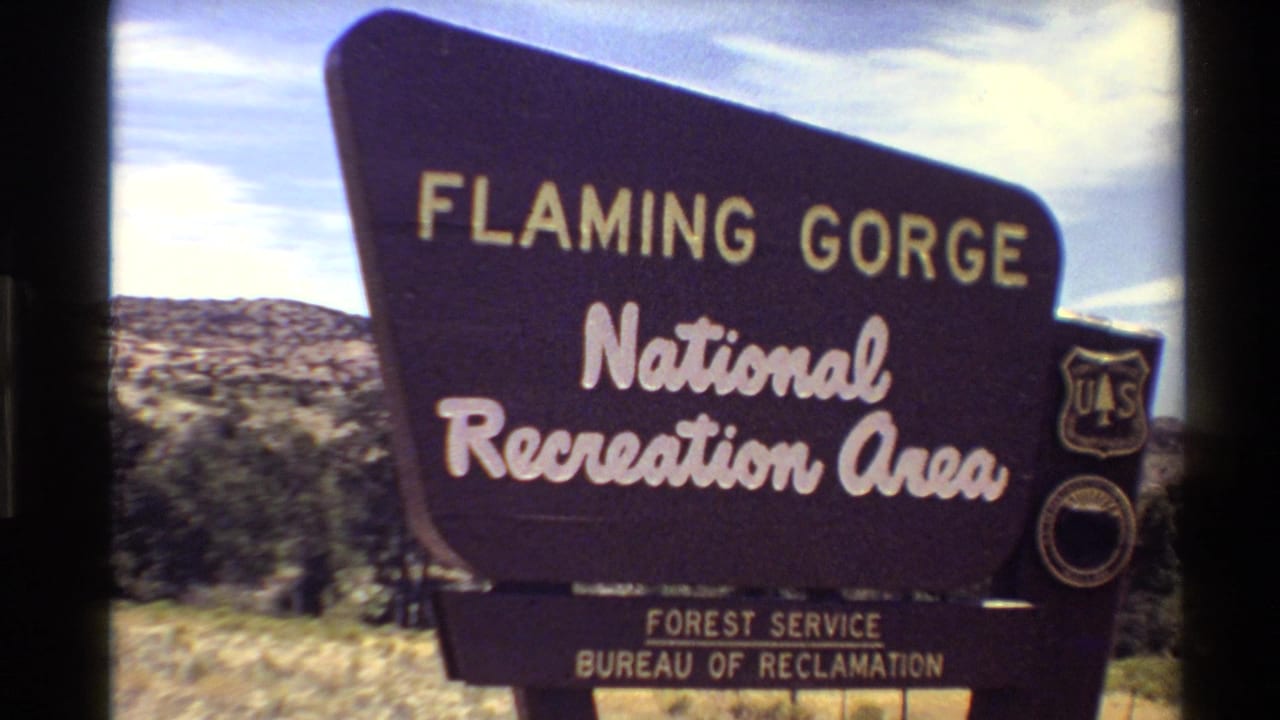 Roadside sign for Flaming Gorge National Recreation Area with federal agency markings.