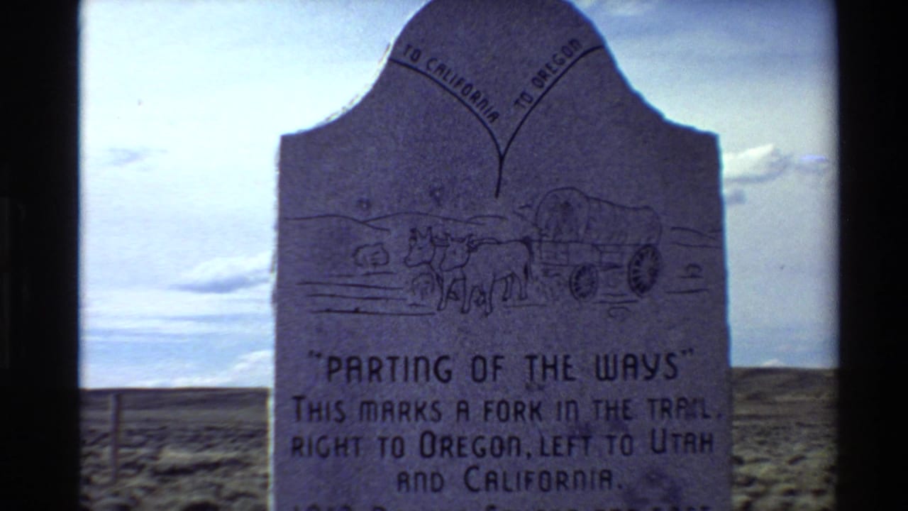 Stone marker reading "Parting of the Ways" in an open desert setting.