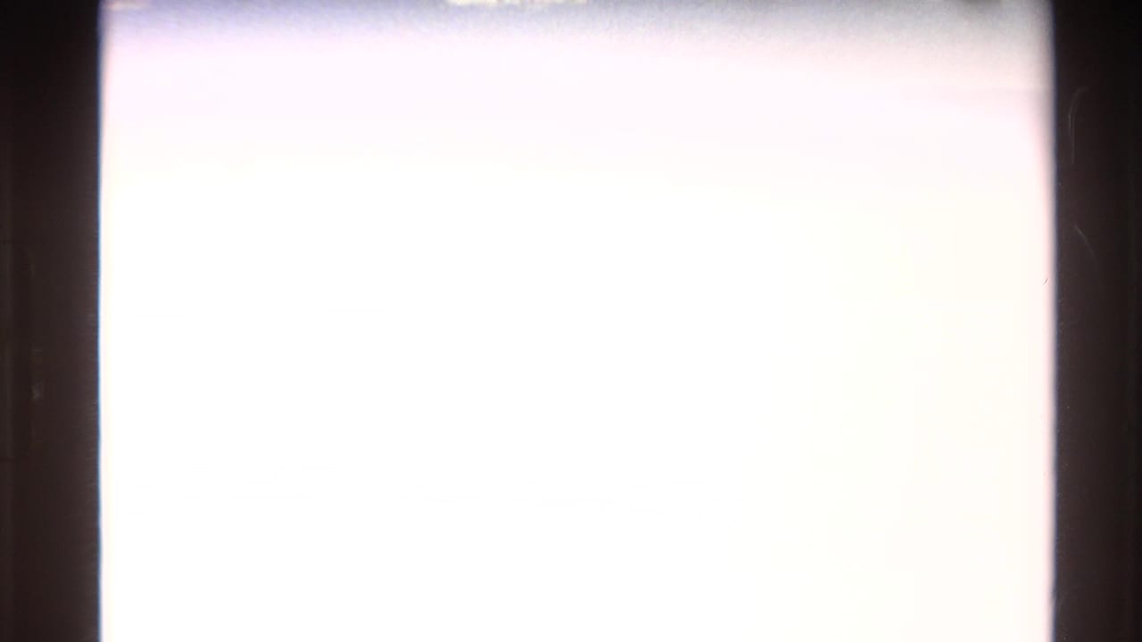 Western USA 1980 8mm frame with an overexposed left area and a partial alpine mountain view at the right edge.