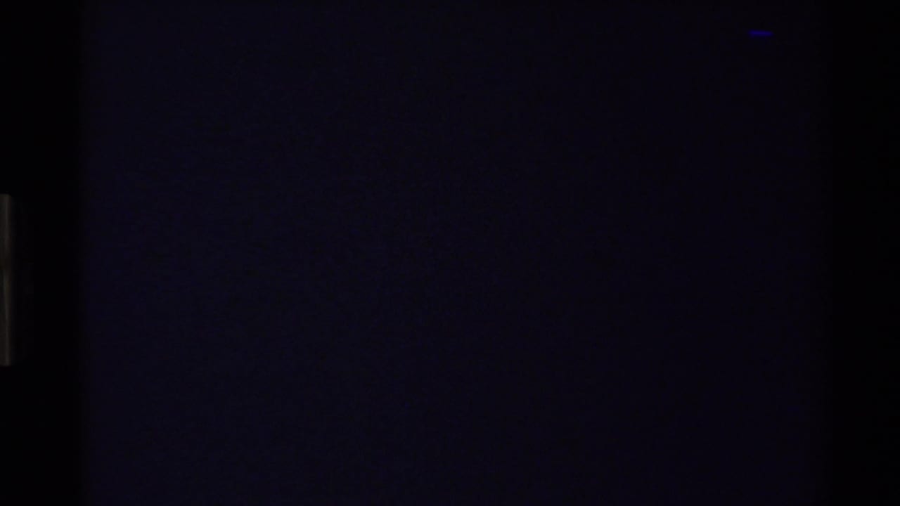 Dark blue-black frame with little visible detail.