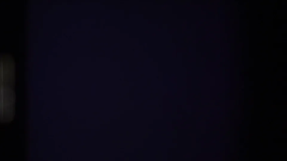 Dark final 8mm frame from the 1980 Western U.S. clip, with the landscape no longer visible and only faint purple-black exposure remaining.