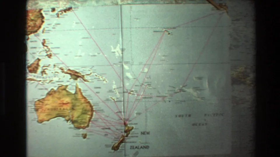 Projected South Pacific map in 1981 8mm footage, showing Australia, New Zealand, island chains, and red route markings.