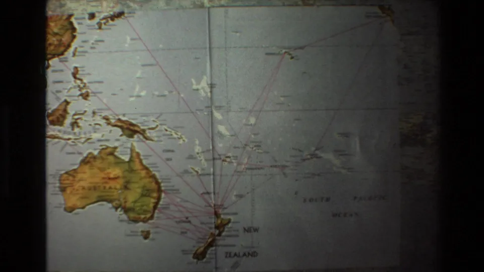 8mm travel map frame showing Australia, New Zealand, and red route lines across the South Pacific.