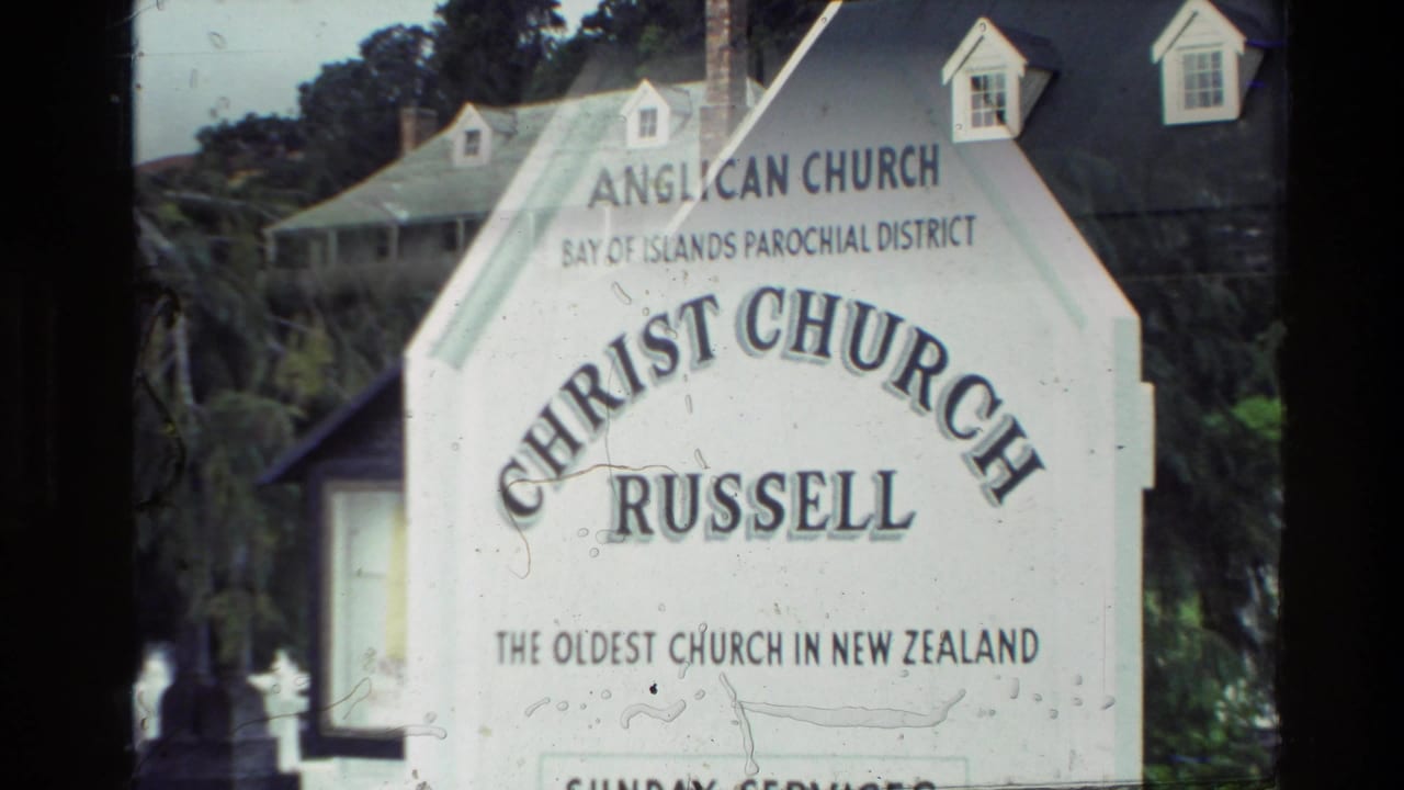 Church sign reading Christ Church Russell, Anglican Church, Bay of Islands Parochial District, in a 1981 New Zealand home-movie frame.