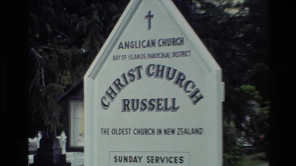 Close 1981 view of the Christ Church Russell sign stating it is the oldest church in New Zealand and listing Sunday services.