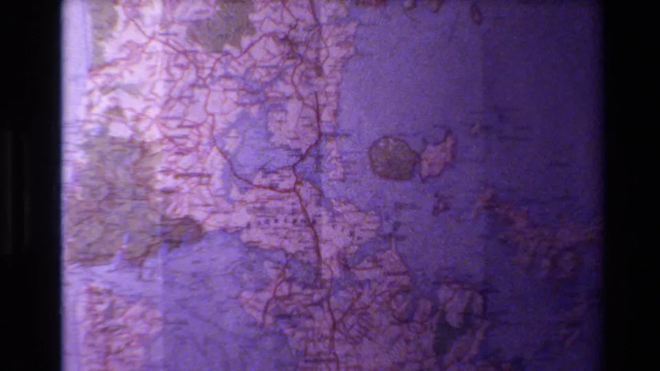 A second 1981 New Zealand 8mm map view shows route markings and coast-like outlines with vignetting and visible grain.