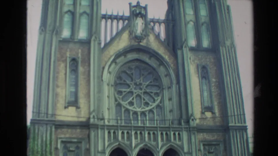1981 New Zealand 8mm view of a Gothic-style cathedral front, centered on the rose window and pointed stone arch.
