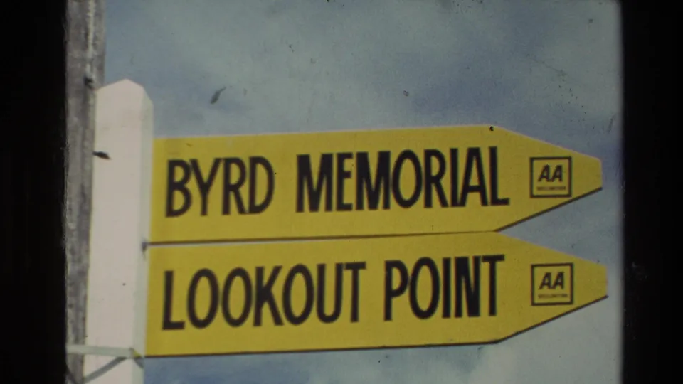 1981 New Zealand 8mm frame showing a yellow sign pointing to Byrd Memorial and Lookout Point with AA logos.