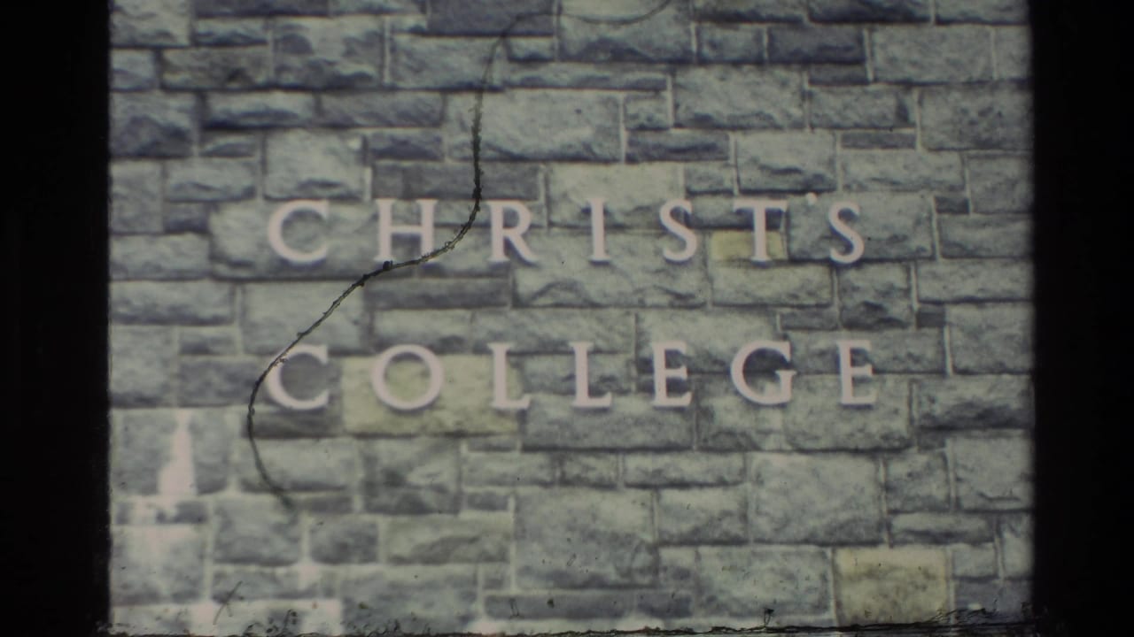 Close view of a stone wall engraved with the words Christ's College.