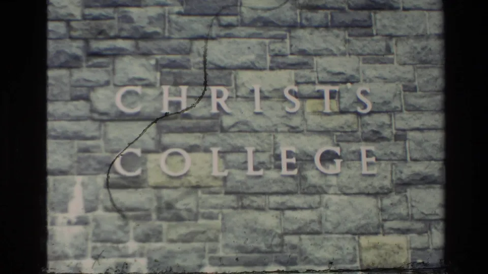 1982 8mm frame showing the Christ's College name mounted on a stone wall in New Zealand.