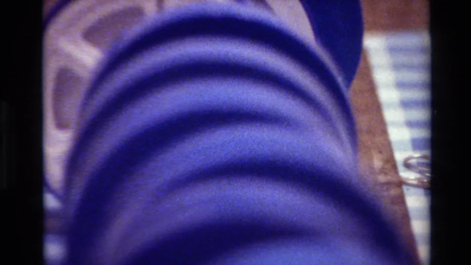 A blue film spool appears in close-up, likely 8mm home-movie material from the Big Sur 1980 reel metadata.