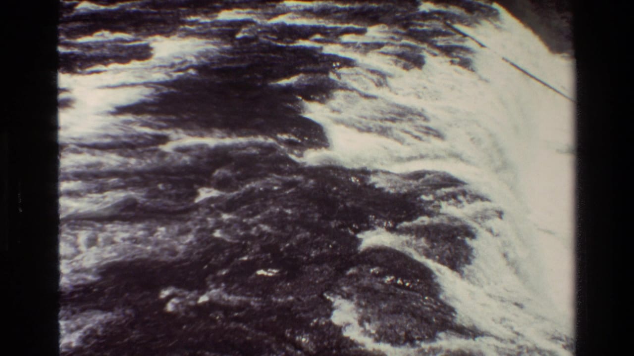 Grand Teton 8mm footage shows a bright band of rushing water beside darker, churning river texture.