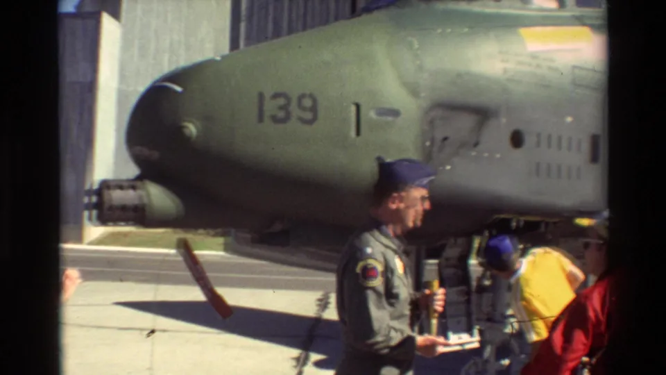 A military aircraft nose marked 139 is shown at Beale AFB as uniformed personnel and visitors stand nearby in daylight.