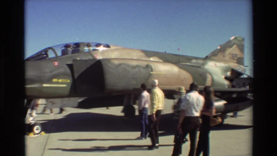 Visitors walk past the side of an F-4 Phantom II on display at the 1981 Beale AFB air show.
