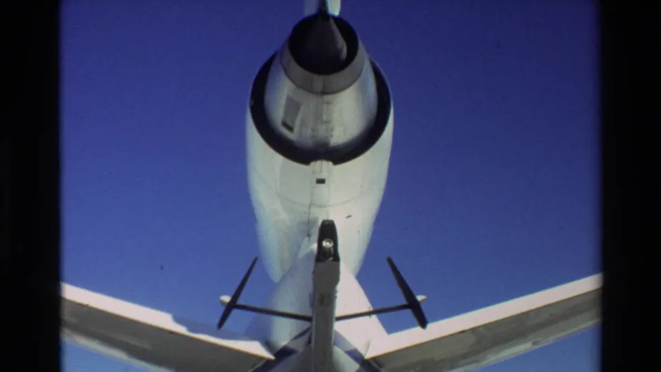 1981 Beale AFB frame looking up at the rear underside of the C-141, showing the engine intake, tailplane, wing edges, and fuselage surface.