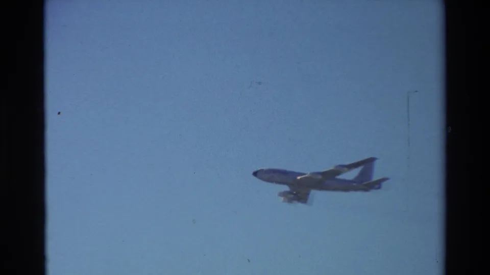 Wide 8mm view of a U.S. Air Force tanker in flight over Beale AFB, California, supported by the clip metadata.