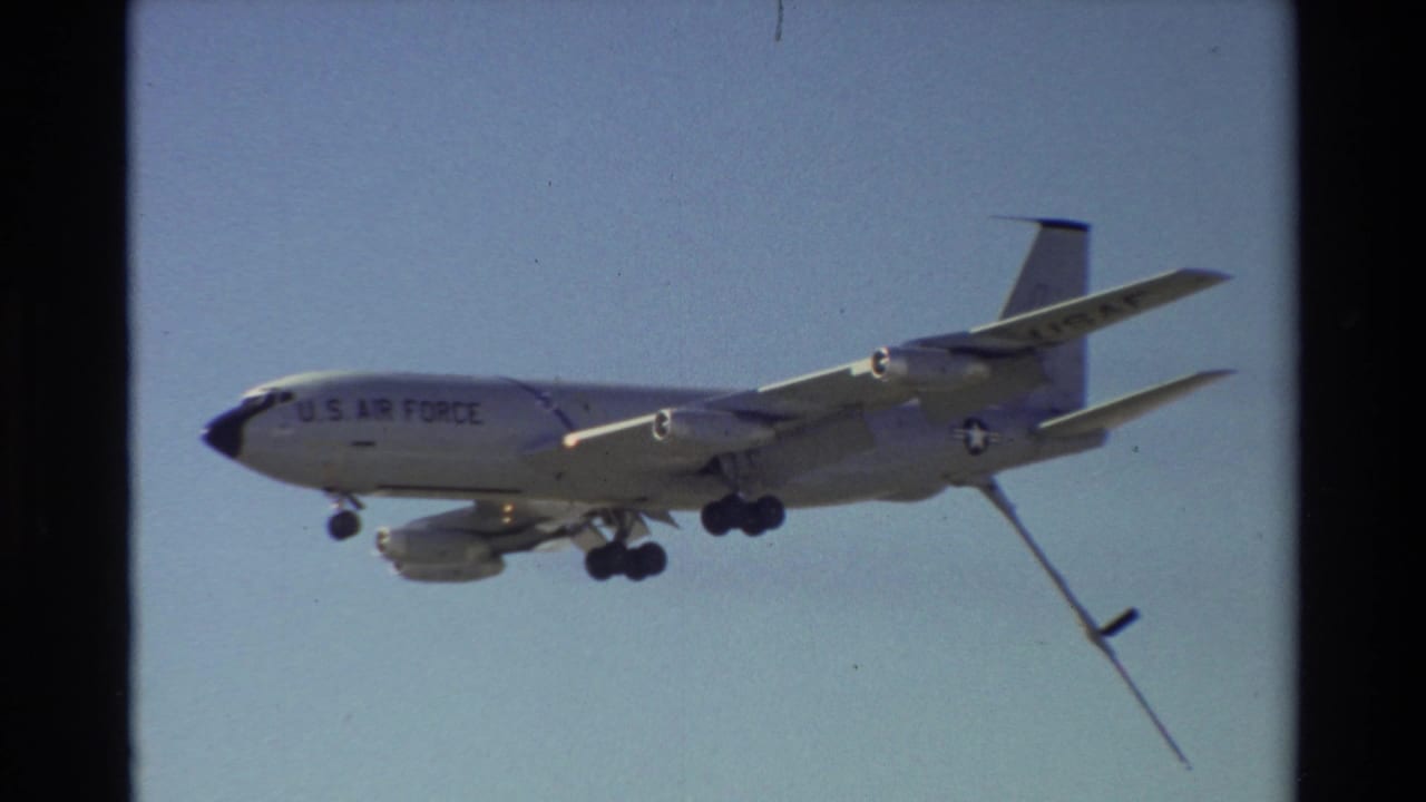 U.S. Air Force tanker seen from the side with refueling boom trailing below.