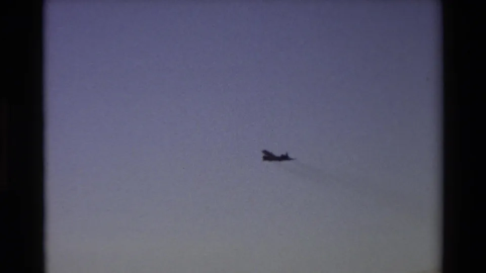 A distant aircraft silhouette continues across the open sky in the 1981 Beale AFB home-movie footage.