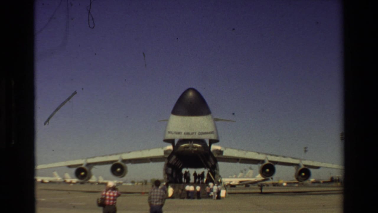 At Beale AFB in 1981, a large C-5 Galaxy transport aircraft sits open for visitors on a sunny airfield.