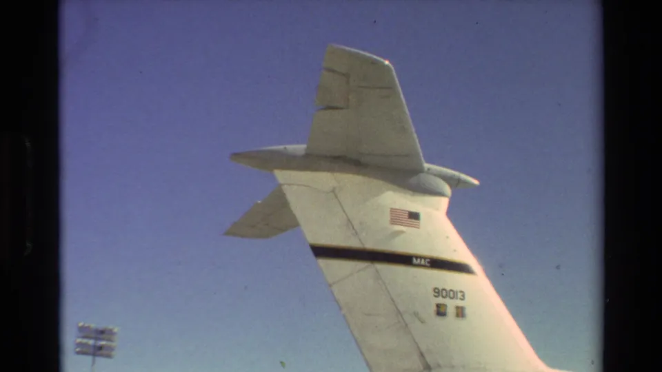 The tail of the C-5 Galaxy is shown at Beale AFB, with U.S. flag marking and aircraft number visible on the fuselage.