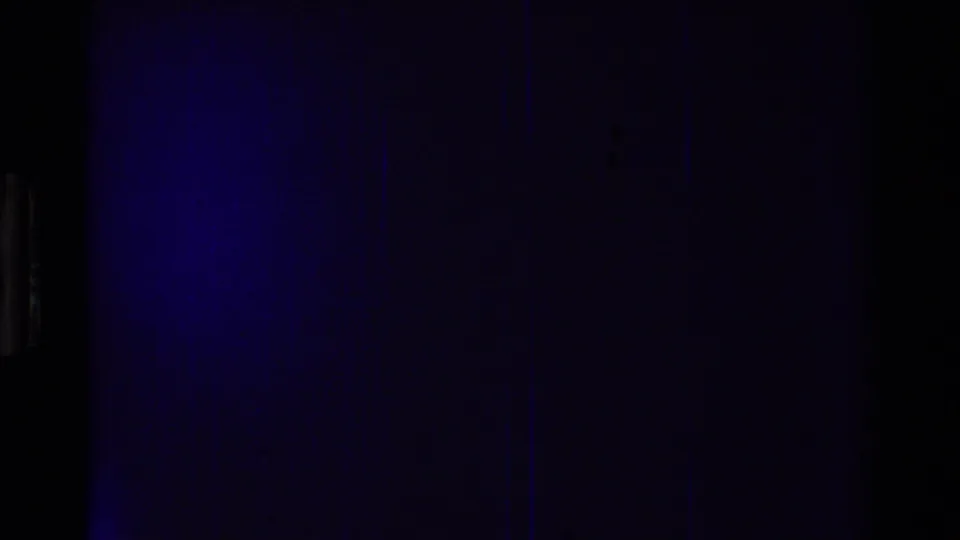 End frame from the 8mm scan showing mostly dark blue exposure with little visible aircraft detail remaining.
